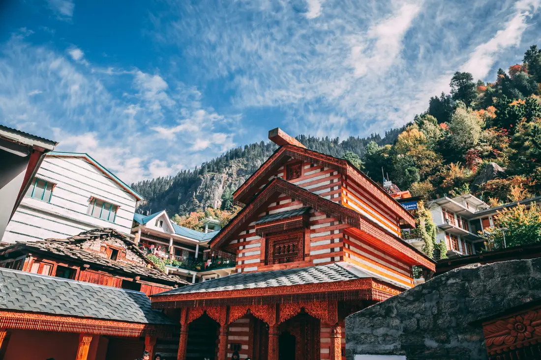 Colourful buildings and a temple on a hillside in Shimla